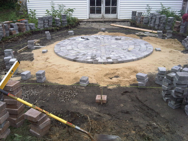 Laying the pavers for the circular patio