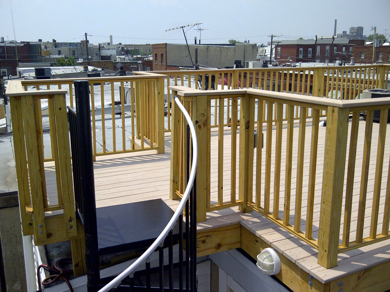 View of finished roof deck from stairway